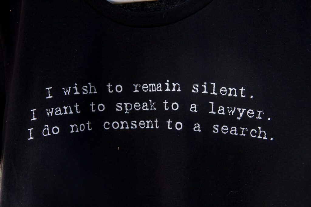 a black t - shirt with a poem written on it